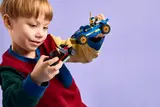Child playing with Ninjago race cars.