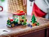 LEGO 40746 set on wood table with elf and gifts.