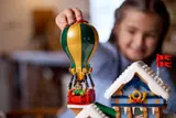 Child playing with hot air balloon.