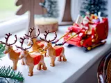 Close-up of LEGO reindeer pulling sleigh.