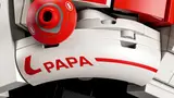 'PAPA' decal detail on helmet.