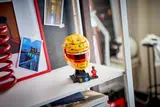 LEGO helmet on a shelf display.