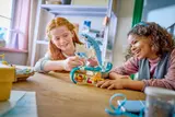Children enjoying LEGO dolphins.