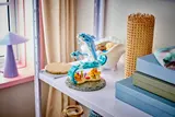 Dolphin model on a shelf.