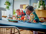 Child playing with harbor set.