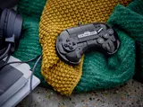 Controller on knitted blanket.
