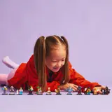 Child admiring minifigures.