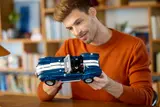 Man inspecting Cobra engine.
