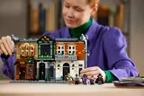 Person interacting with LEGO Book Nook.