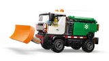 Snowplow with minifigure driving.