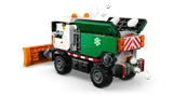 Snowplow with open hopper spreading snow.