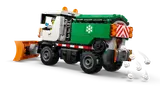 Snowplow in action, spreading snow.