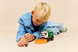 Child playing with Snowplow.