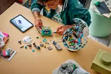 Boy building interior modules of LEGO Soccer Ball.