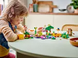 Child Playing with LEGO Mario