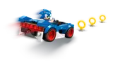 Sonic car with motion blur and glowing rings.