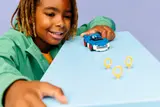 Child playing with Sonic car and rings.