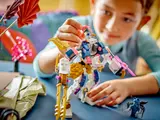 Child playing with mech, adjusting arm.