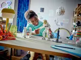 Child with LEGO Astronaut