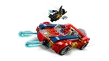 Car firing blasters as Wolverine leaps.
