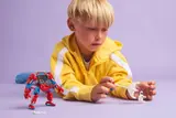 Child plays with Anti-Venom and web.
