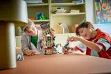 Kids playing with Daily Bugle.