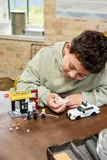 Child examining The Spot minifigure