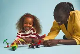 Playing with LEGO vehicles.