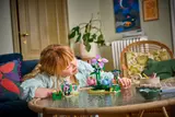 Child observing LEGO Friends set.