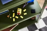 SpongeBob figure disassembled on shelf.