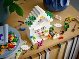LEGO white cottage with spring garden.