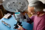 Man examining nacelle.