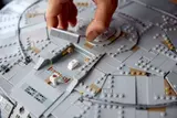 Hand placing greeble detail.