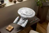 Enterprise D on wooden bench.