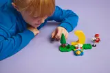 Child playing with LEGO Celeste set.