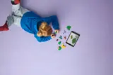 Child building with digital instructions.