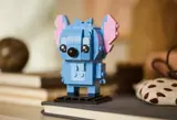 Stitch model on books in a cozy setting.