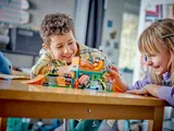 Kids playing with LEGO skate park.