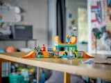 Wider view of kids playing with skate park.