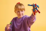 Child playing with mech.
