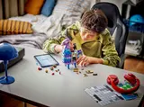 Boy building LEGO Llama.