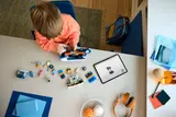 Overhead view of LEGO Sonic truck parts and building process.