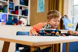Child playing with LEGO Sonic Command Truck.