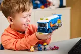 Child holding LEGO Sonic Command Truck.