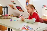 Child playing with Marie.