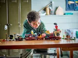 Child playing with Bowser train