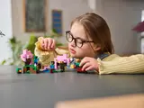 Girl playing with Minecraft LEGO.