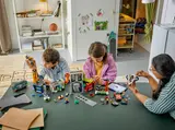 Collaborative building with LEGO City 60473 modular sections.