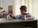 Child playing with 'The Devourer Ambush' set.