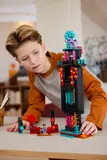 Child interacting with Enderman Tower.